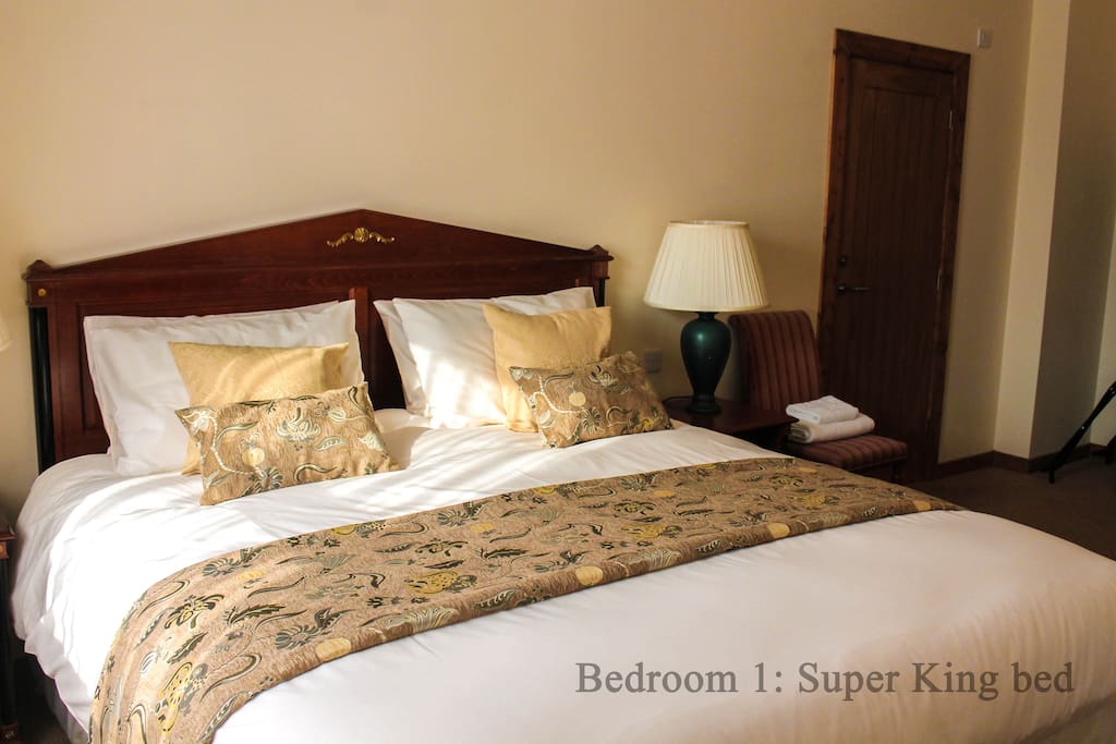 Master bedroom with a super king sized bed, en-suite and smart TV.