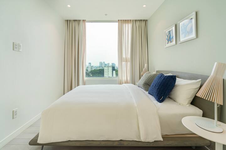 second bedroom with view of the city and the park