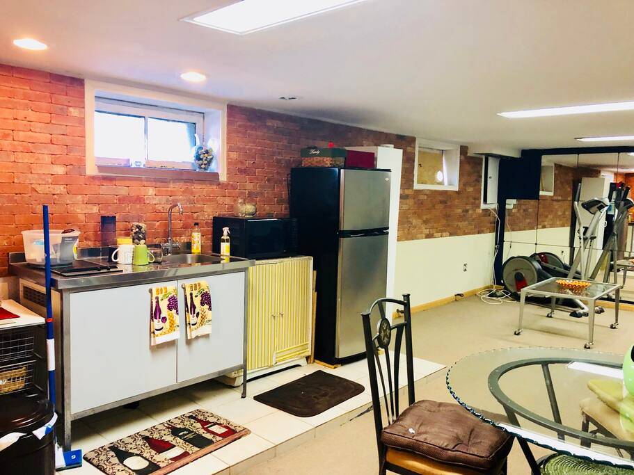 Kitchen area with refrigerator and sitting area