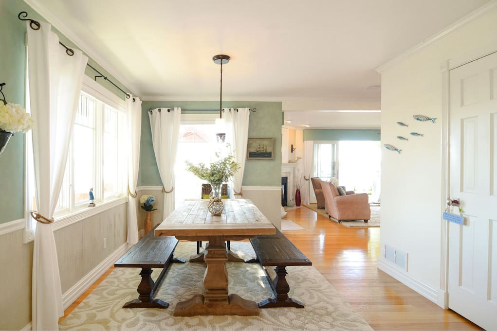 Dining area with farm table overlooking Lake Minnetonka and deck