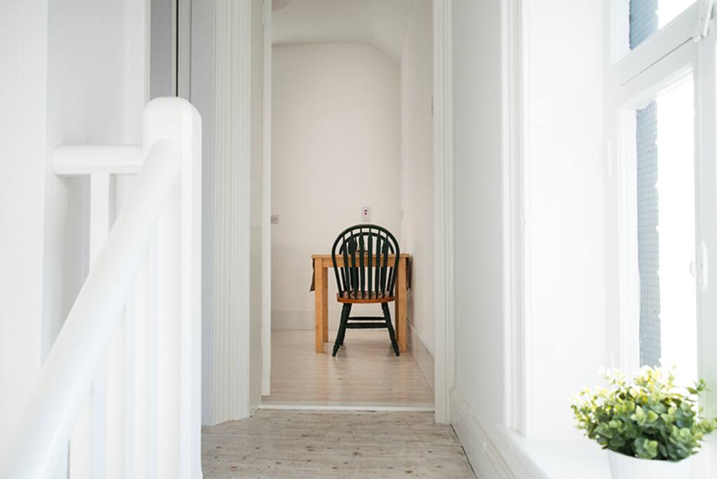 Bedroom on left. Kitchen/Dining/Sitting Room straight ahead.