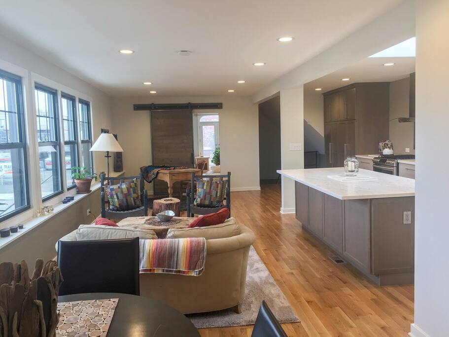 Living room and kitchen island from the East bedroom