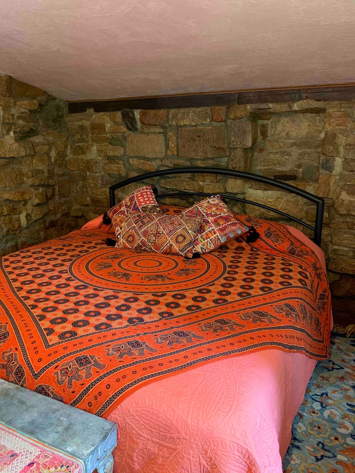 In the rock portion of the cottage, enjoy a peaceful nights rest in a kIng size bed. 