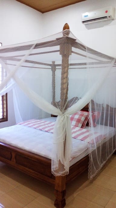 Beautiful romantic bed. mosquito net and Air conditioning.