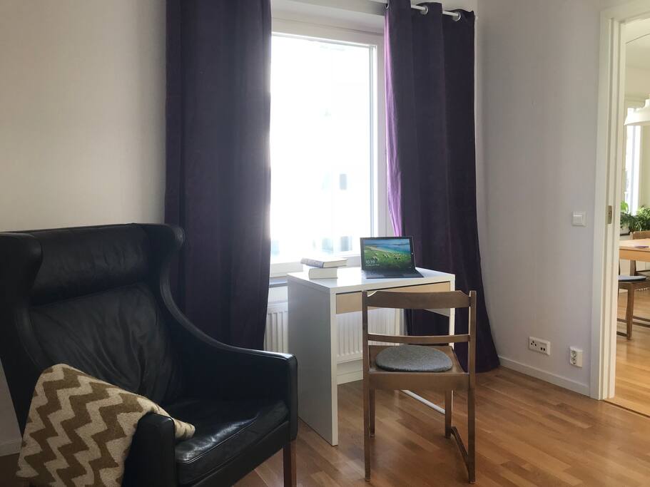 Work-desk and comfy chair in your bedroom.