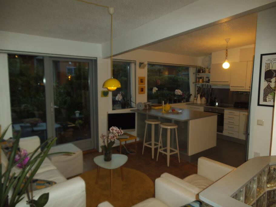 Upstairs sitting area, and kitchen. Door leads to the back garden.