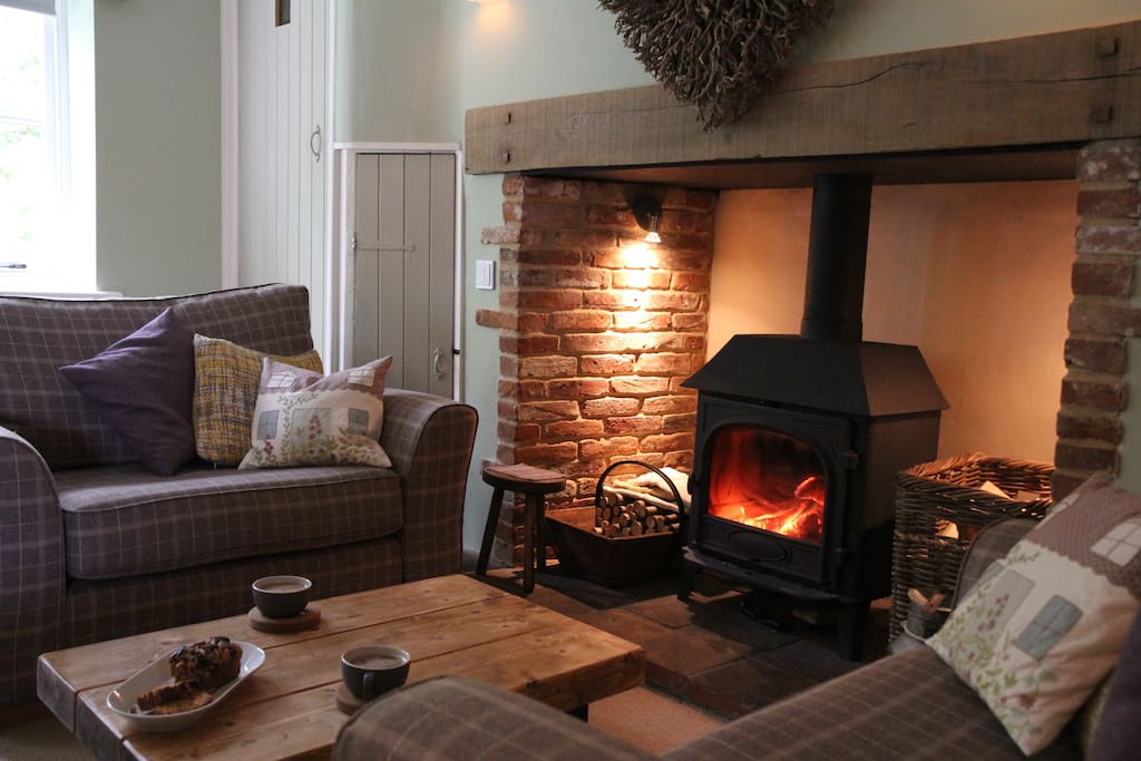 Lounge area with amazing log burner and VERY comfy sofas!