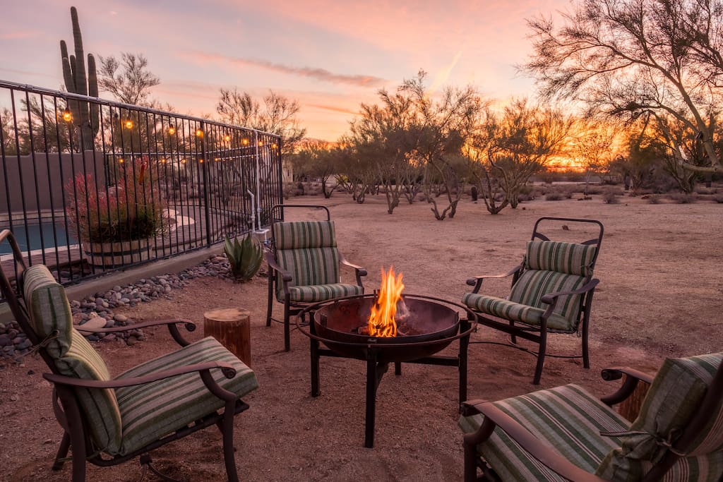 Enjoy the night air around the fire pit while watching the sun set behind the palo verde trees.