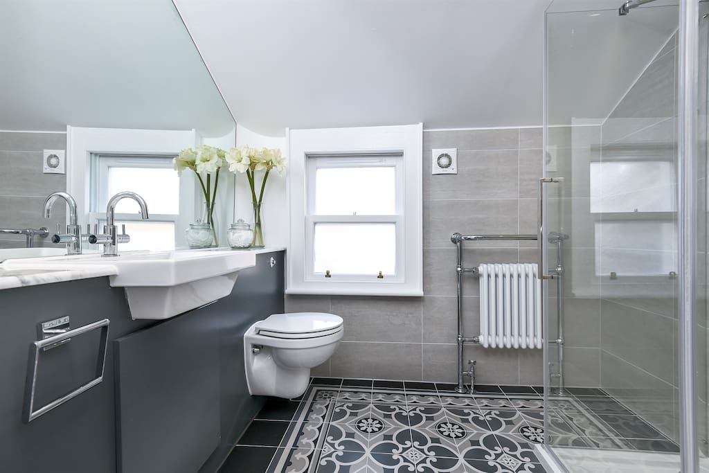 Shower off in opulence in this classically designed shower room which serves the zen and serene rooms