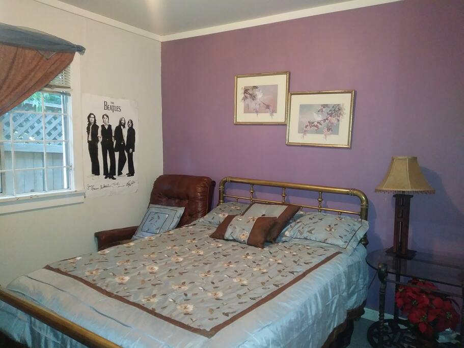 Queen comfortable Bed in lighting room with sitting couch