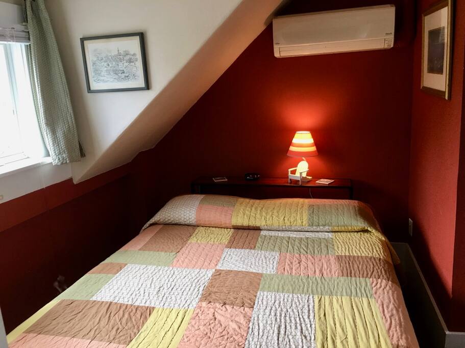 Bedroom with Queen Bed and Wall mounted AC