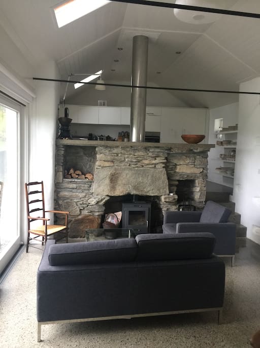 The large kitchen/dining has a living area with wood burning stove