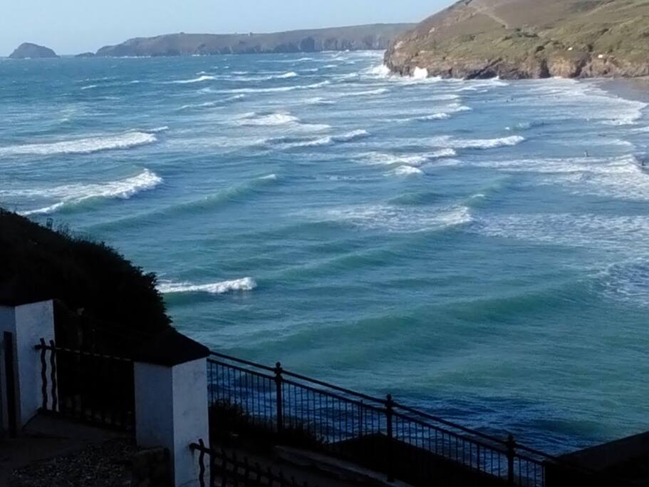Perranporth's wide golden beach covered by the incoming tide