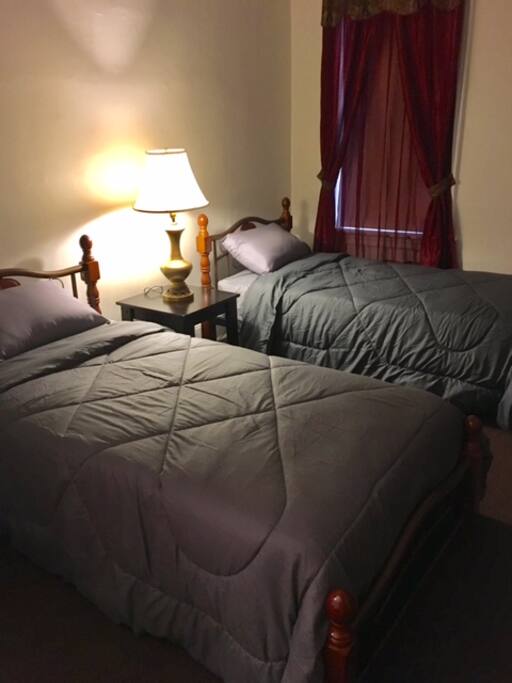 Front Bedroom. Two Single Beds and Drawers.
