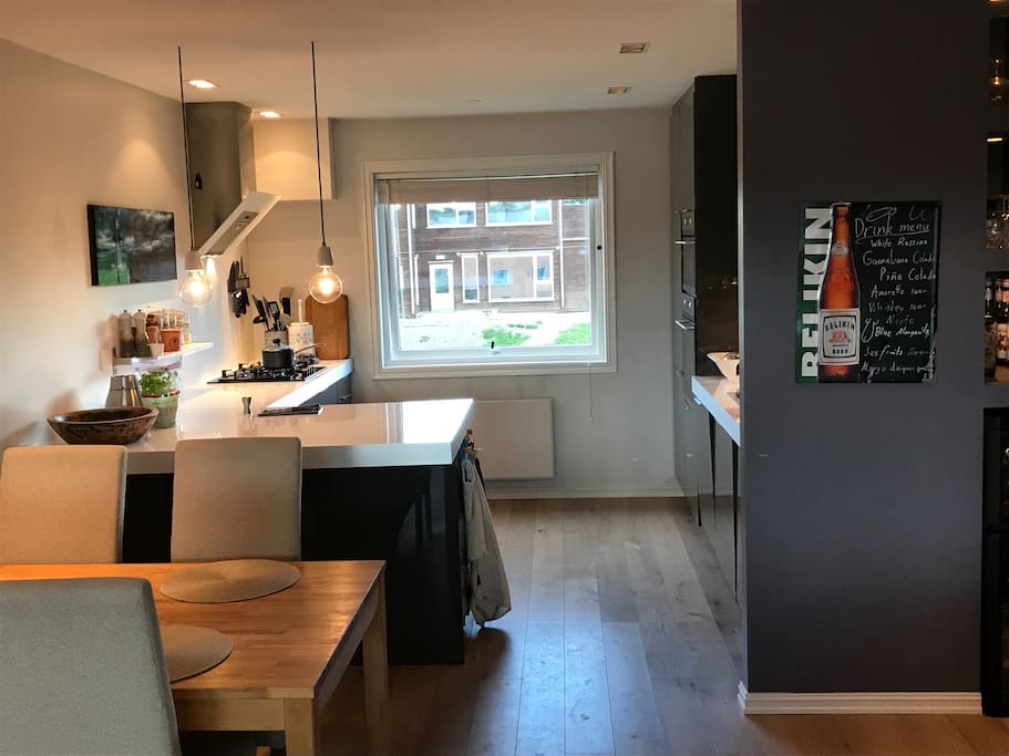 Kitchen is in the other end of the livingroom, making it a big room with much light. Great kitchen for enthusiasts. Has water boiler, coffeemachine, smothiemachine, ice-machine, sodastreamer, microwave and lot more.