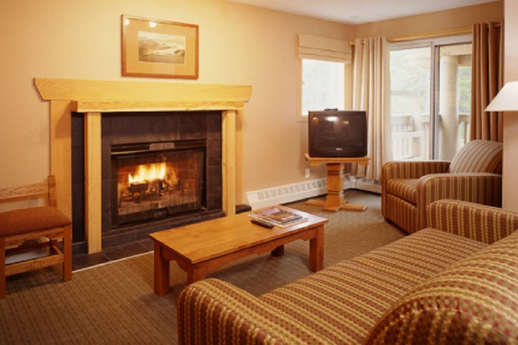Living room on main with wood burning fireplace