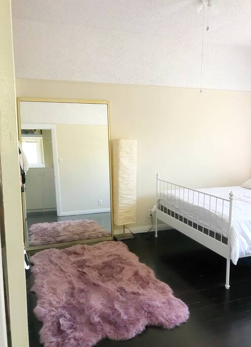 bedroom with queen bed and closet space