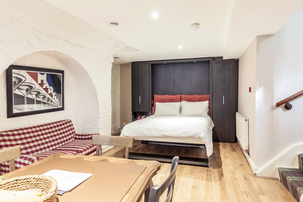 This high-quality Italian wall bed can be put away to create another sofa.