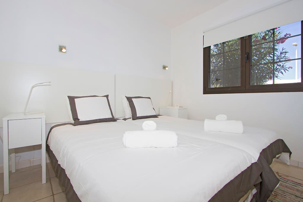 Master bedroom. Both bedrooms have ceiling fans.
