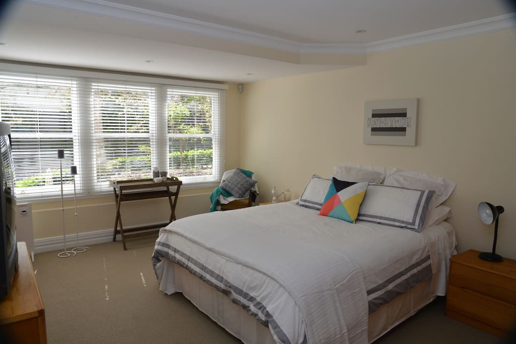 Your luxury accommodation: Large master bedroom with king size bed, en-suite and TV.