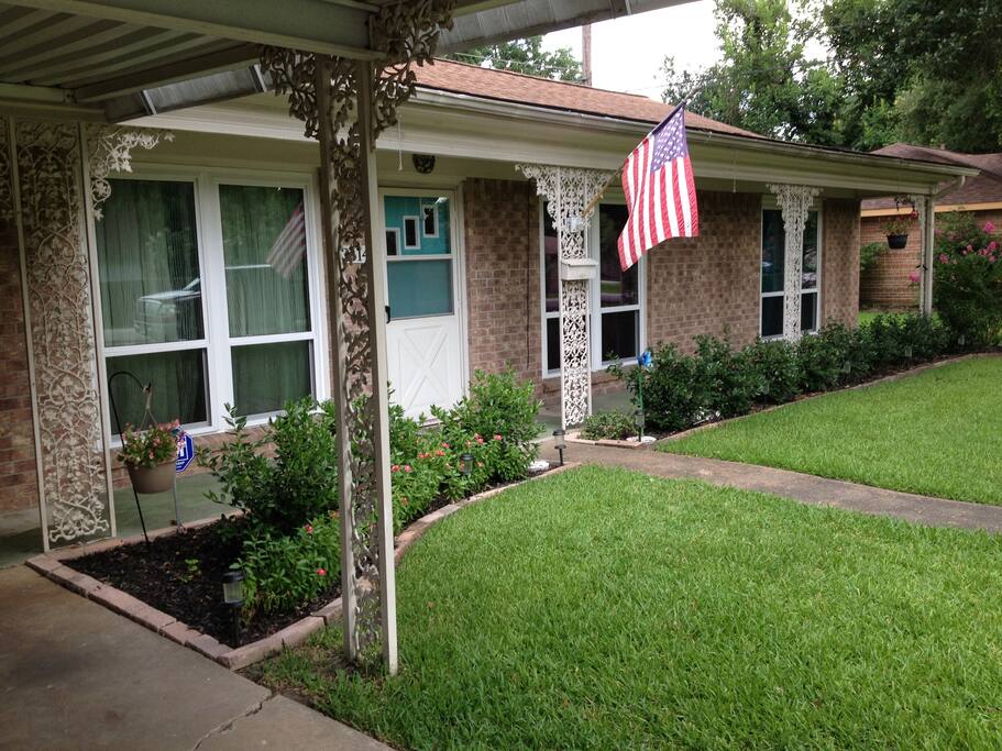 Front of the house with new windows and green grass!
