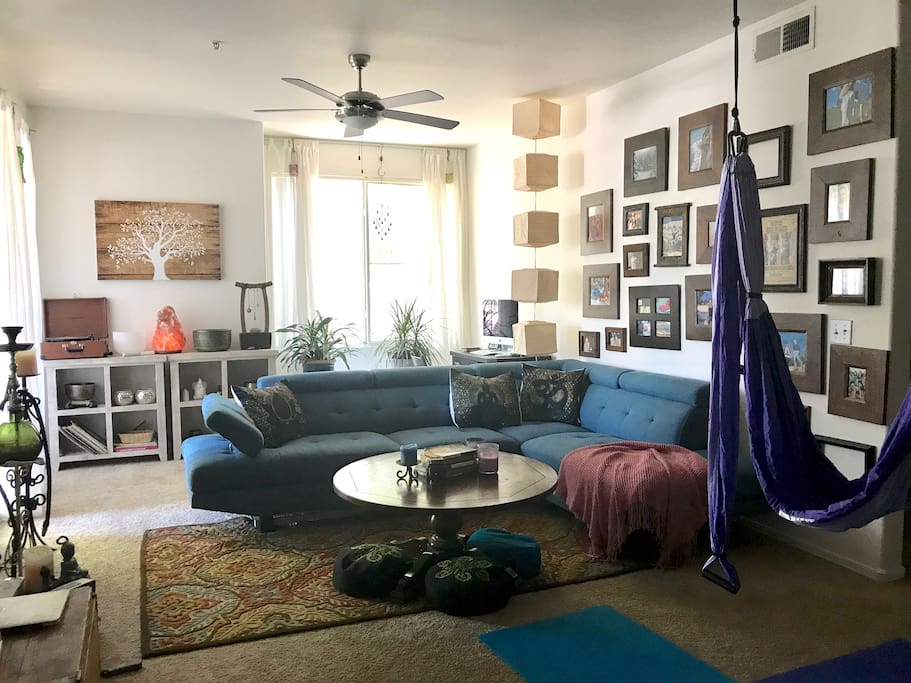 Zen space with a yoga trapeze and enough space for 3 people to do yoga