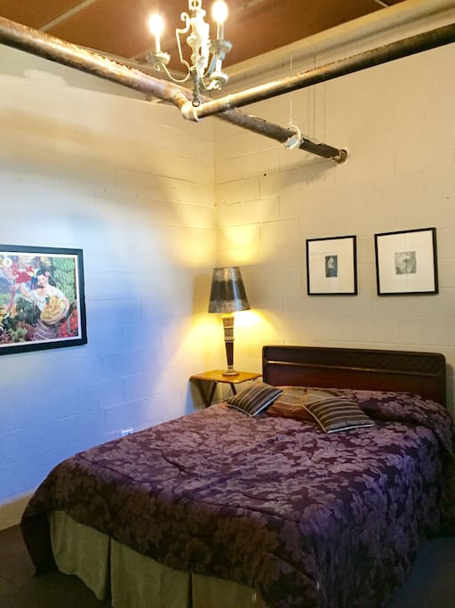 Queen sized pillow top makes for super comfy sleeping in this bright and airy room.