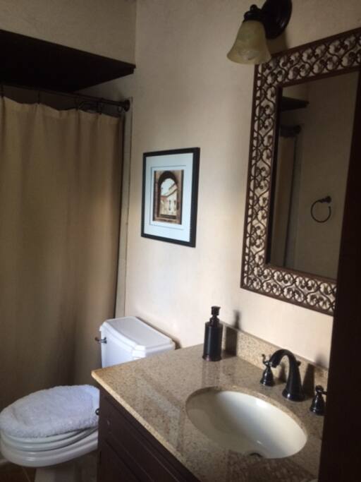 Private bathroom, with door to the back deck.