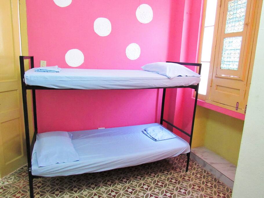 Shared, air-conditioned dorm rooms with enclosed full, private bathroom, linens and daily cleaning included.