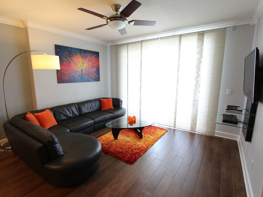 Living Room With Gorgeous Italian Leather Sofa And Contemporary Decor