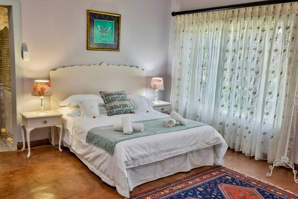 Room 3:Queen size bed. Spacious with door opening to garden, and en-suite bathroom.