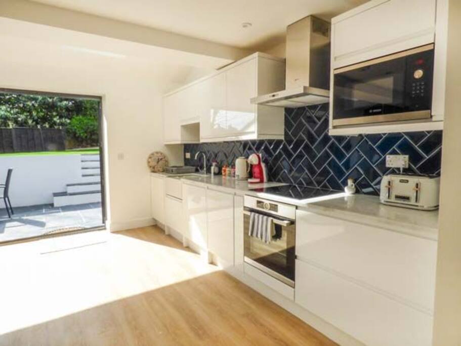 Kitchen with access to garden through bifold doors