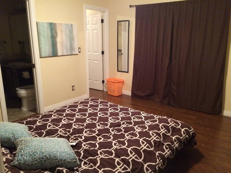 Large bedroom upstairs with queen bed, walk in closet and full ensuite bathroom