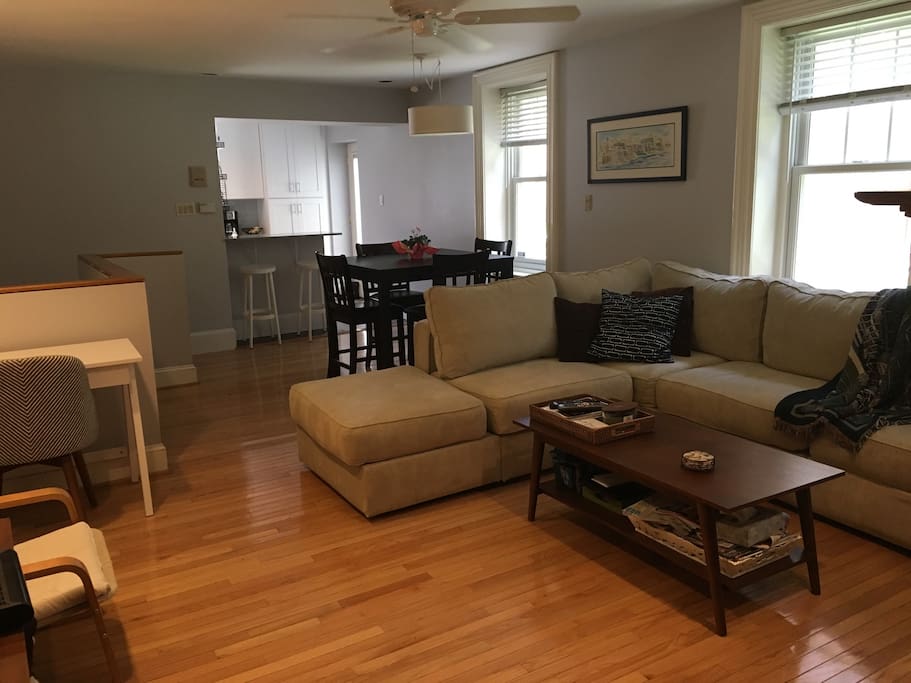 Open concept living room into dining and kitchen