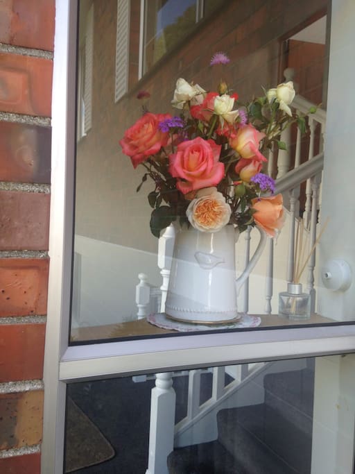 Fresh cut flowers welcome you into our home.