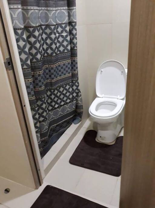 toilet and bath with hot and cold shower