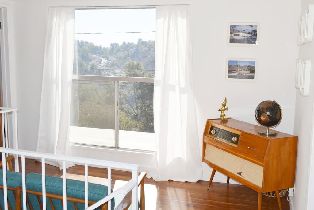 Upper landing sitting area with canyon/city views.