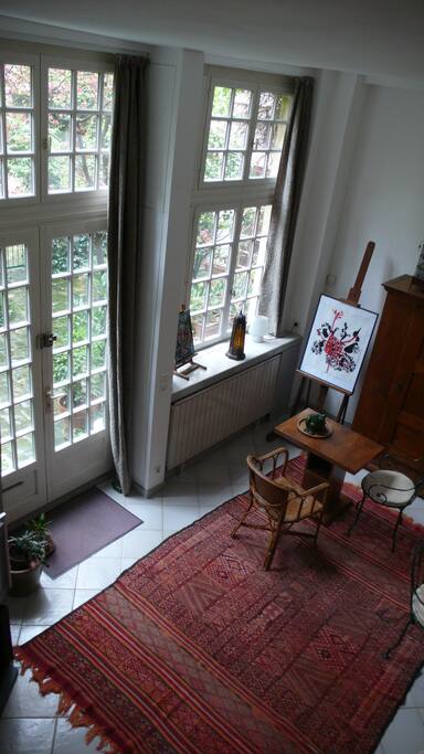 View of the living room. The windows give on to a private courtyard.