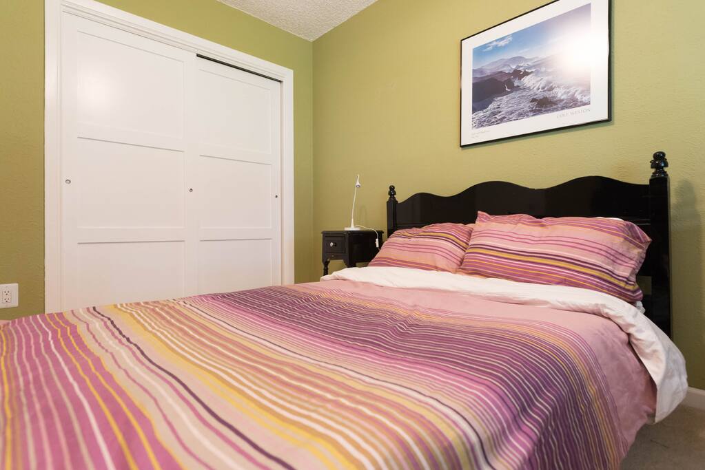 The bedroom is in the back of the house. Huge closet space, comfy firm mattress, and quiet view of the back yard.