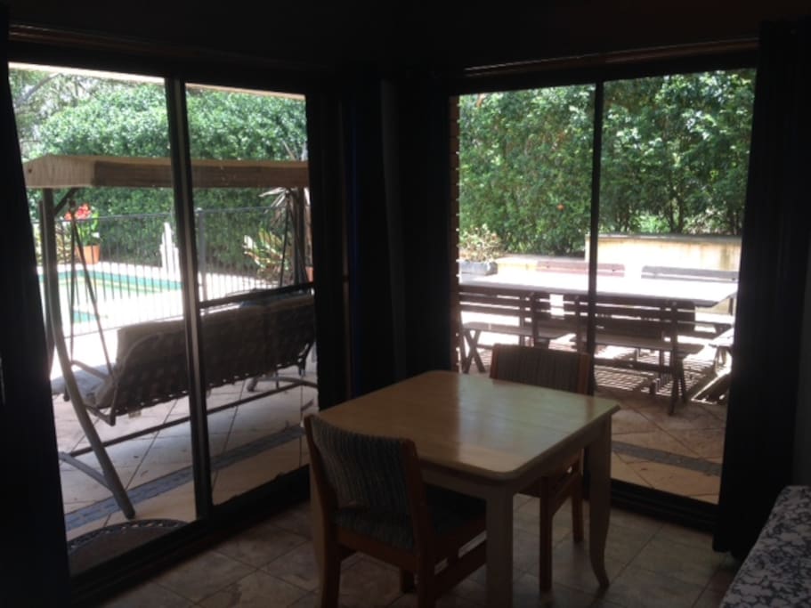 The room looks onto the pool.