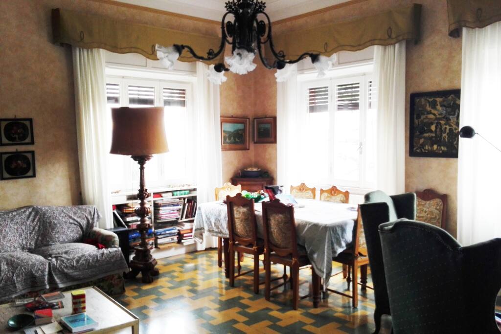 The very spacious living room with many seating areas with library.