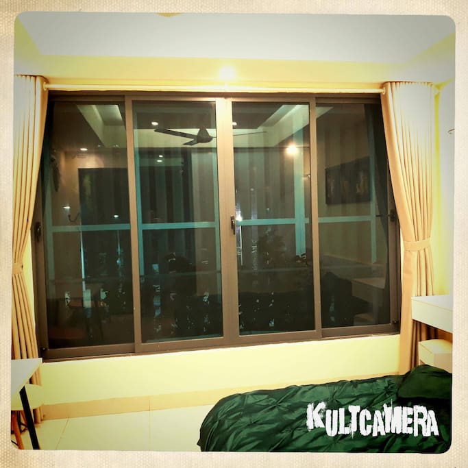 Wide window with anti mosquito netting and curtain