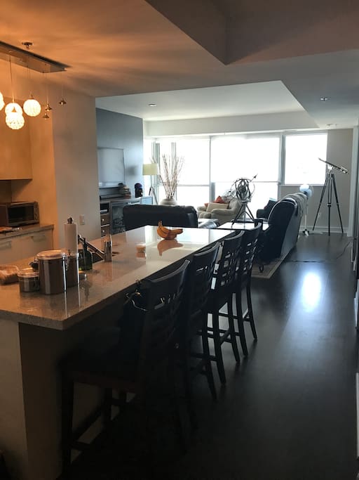 From the front hallway, view of living room and kitchen.