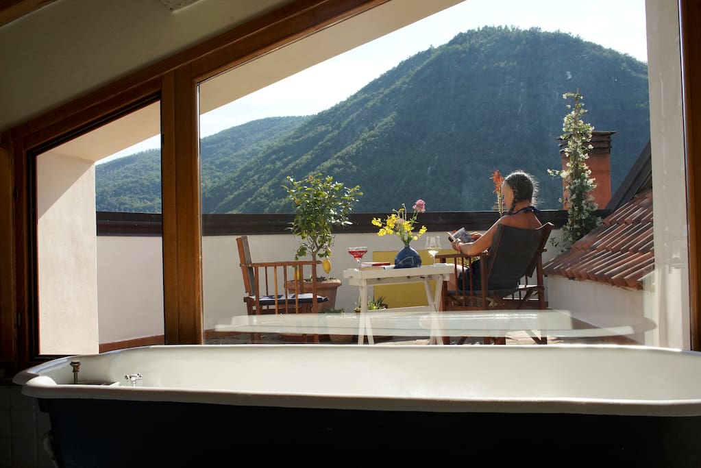 The Top Floor bedroom has its own bathroom and private terrace with a panoramic view
