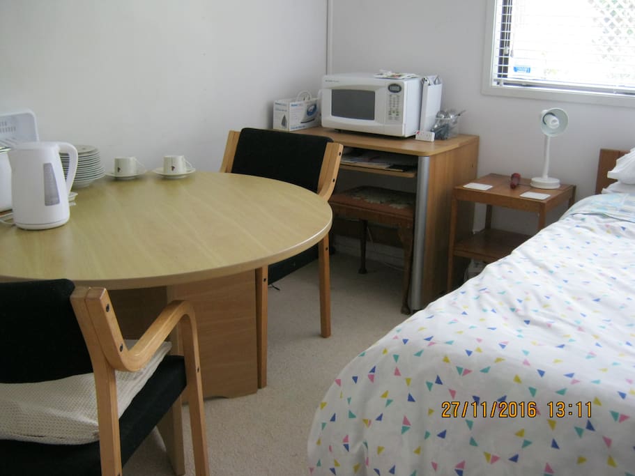 Single bed and breakfast table