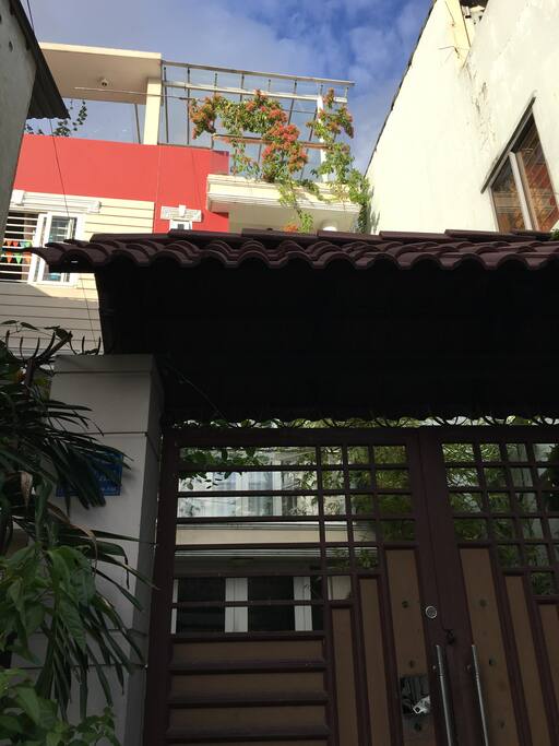 Big house with a lot of trees and beautiful terrace! Easy to recognize!