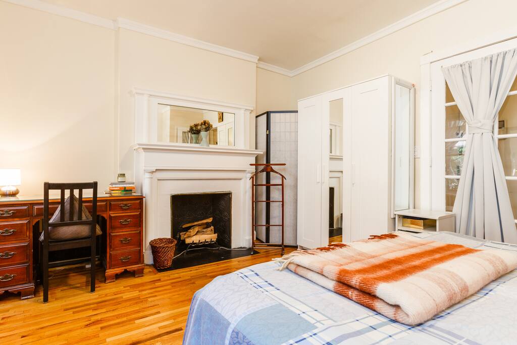 Bedroom with chic french doors and blackout curtains for comfortable sleep