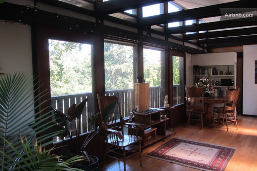 Sunny spacious living space with a wrap around deck.