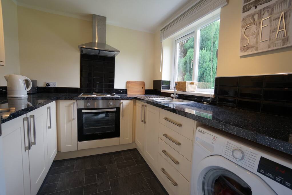 Newly refurbished. Washing machine, fridge freezer and microwave. All new dinner ware cutlery etc. Includes fire extinguisher and Saint Johns first aid kit.