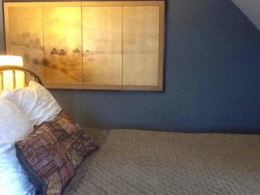 This handsome and uncluttered bedroom is where you will be staying.